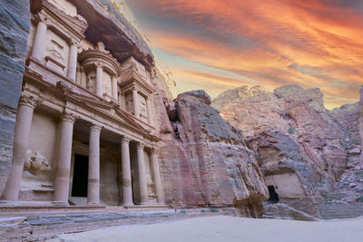 Low angle view of historic building against sky during sunset