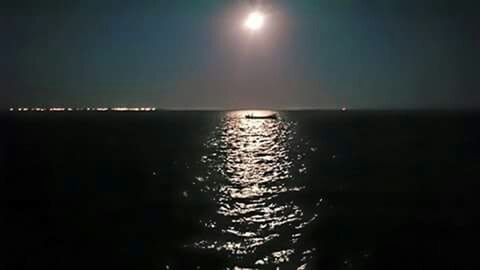 Reflection of clouds in water at night