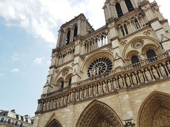 Low angle view of bell tower against sky