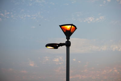Close-up of street light against sky