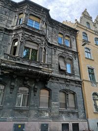 Low angle view of old building against sky