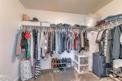 Panoramic shot of clothes hanging in rack