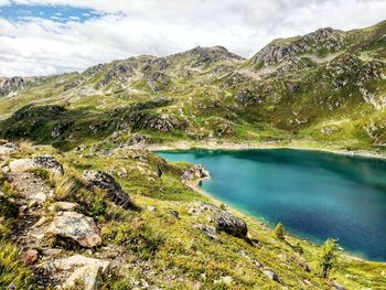 Scenic view of lake and mountains against sky