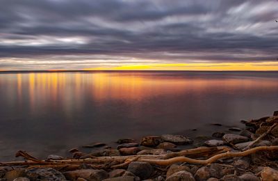 Scenic view of sea against sky at sunset