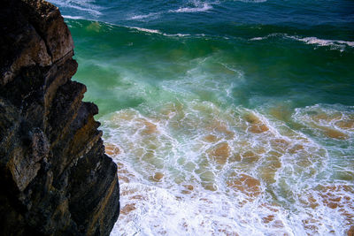 High angle view of rocks in sea