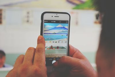 Cropped image of hand holding outdoors