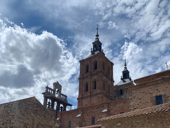 Low angle view of cathedral against cloudy sky