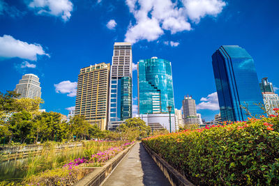 Modern buildings in city against sky