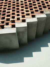 Clay brick wall arranged on a concrete staircase