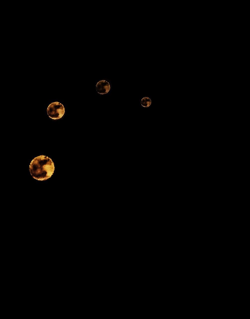 CLOSE-UP VIEW OF MOON OVER BLACK BACKGROUND