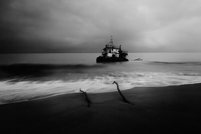 Boat in sea against sky