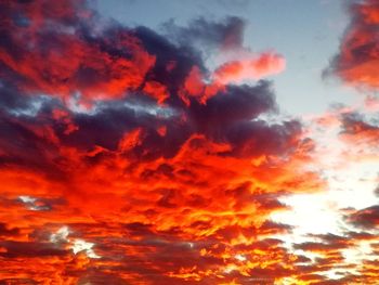 Low angle view of dramatic sky during sunset