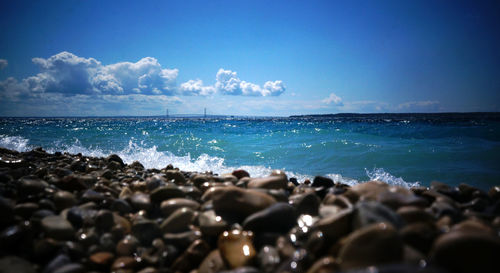 Scenic view of sea against cloudy sky