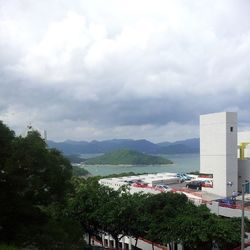 Scenic view of mountains against cloudy sky
