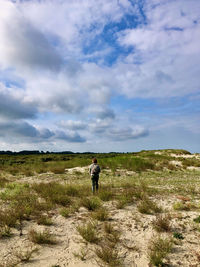 Man on field against sky