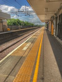 Railroad station platform against sky