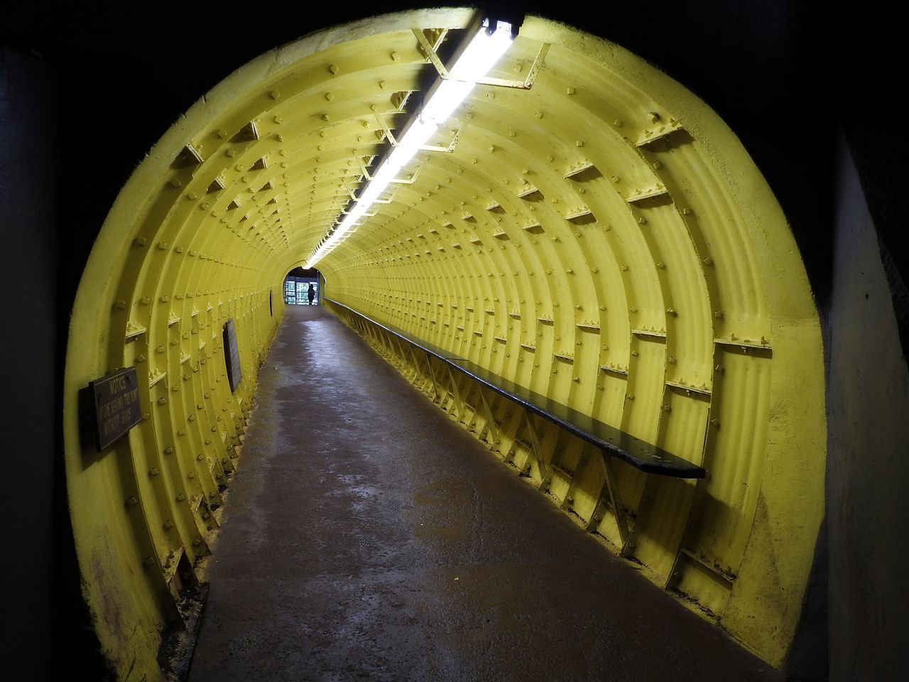 ILLUMINATED TUNNEL SEEN THROUGH BUILDING