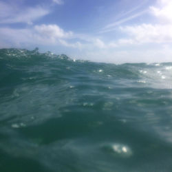 Scenic view of sea against cloudy sky