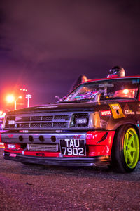 Cars on road in city at night