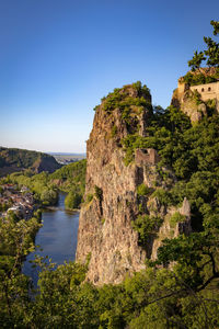 Scenic view of mountains against clear blue sky