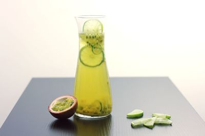 Green fruits in glass on table