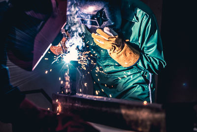 Man working on metal grate