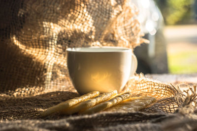 Close-up of coffee cup on table