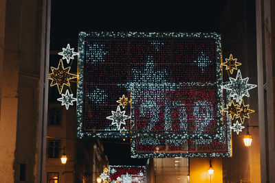 Low angle view of illuminated building at night