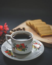 Close-up of coffee cup on table