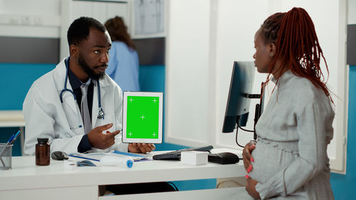 Female doctor working in office