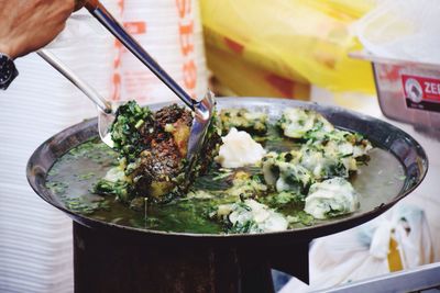 Close-up of man preparing food