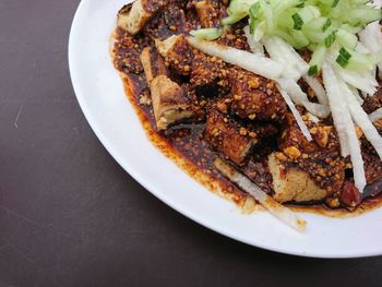 High angle view of meat in plate on table