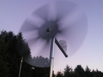 High section of windmill against clear sky