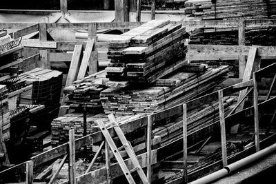 High angle view of stacked planks at construction site