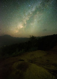 Scenic view of landscape against sky at night