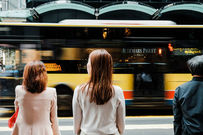 Rear view of people at railroad station