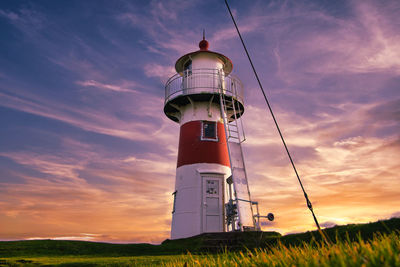 Low angle view of lighthouse against sky during sunset in torshavn