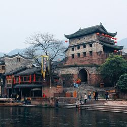 Canal along buildings in city