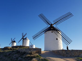 Traditional windmill against clear blue sky