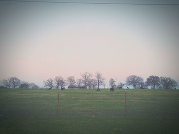 Scenic view of field against sky during sunset