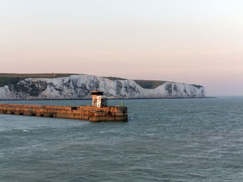 Harbor against white cliffs
