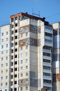 Low angle view of buildings against clear blue sky