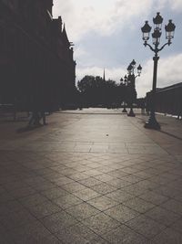 Street light against cloudy sky