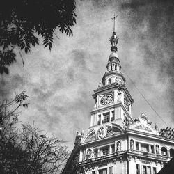 Low angle view of clock tower against sky