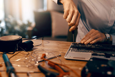 Midsection of man working at table