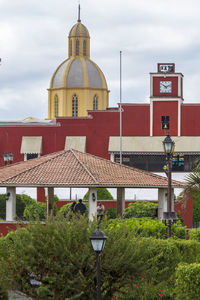 Church by building against sky