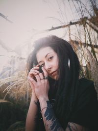 Portrait of woman against plants