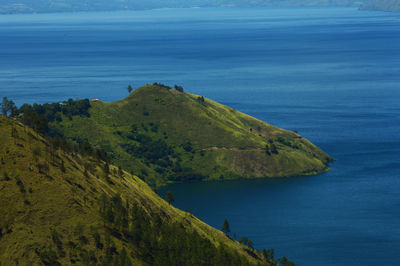 Beautiful lake toba mountains are seen from a height.