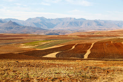 Scenic view of landscape and mountains against sky