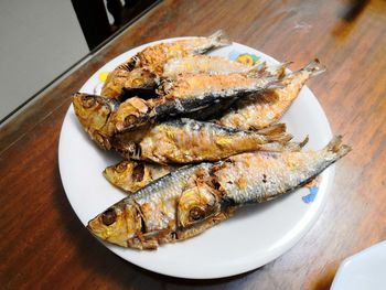 High angle view of fish in plate on table